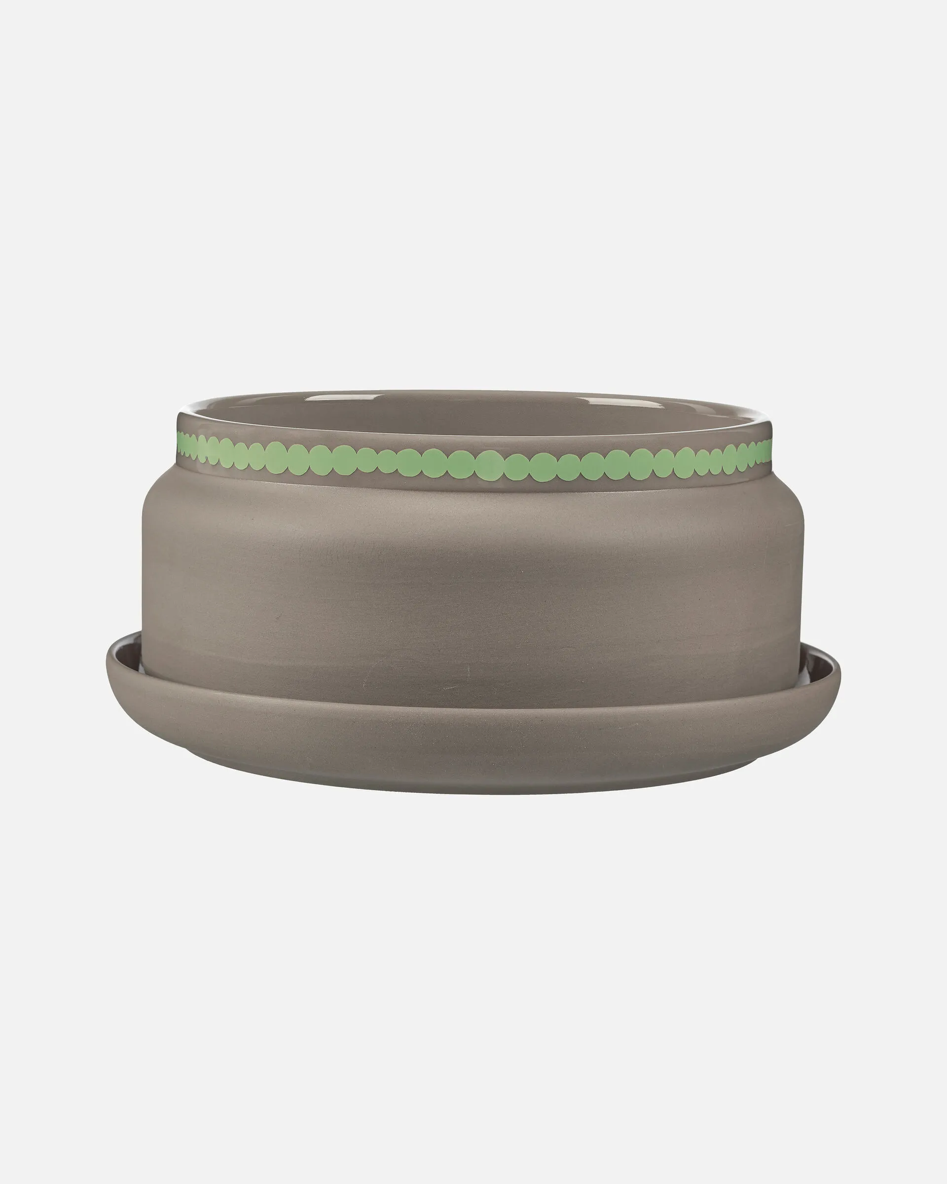 Der Blumentopf SIIRTOLAPUUTARHA von Marimekko ist aus braunem Keramik mit mint details. Er ist 17.5 x 10 cm gross und 2.04 kg schwer.
